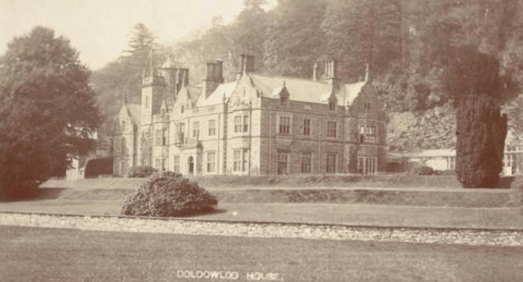 Historic postcard view of Doldowlod House in Radnorshire, showing the house and formal grounds