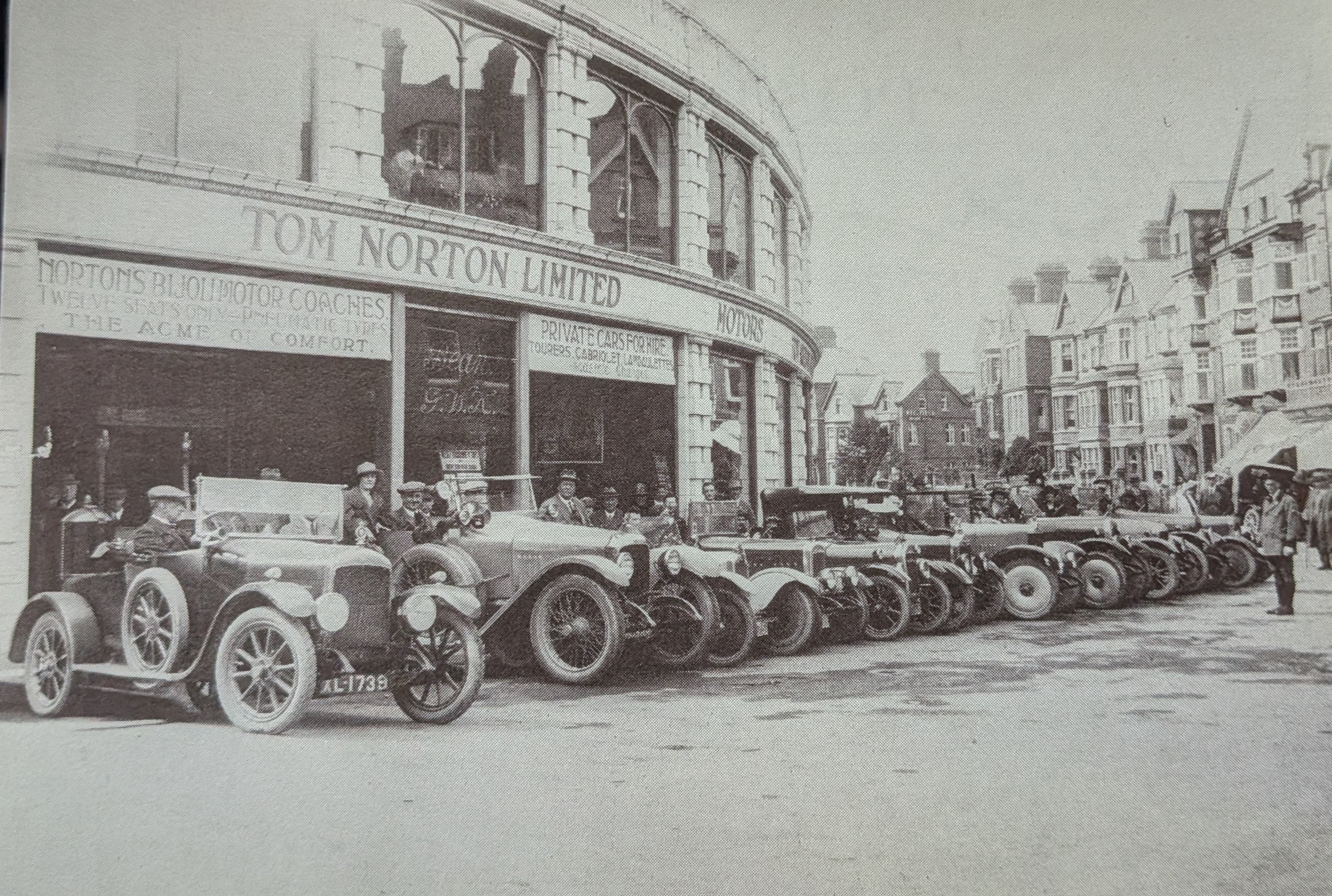Historic photograph of Tom Norton Ltd motor cars outside the Automobile Palace in Llandrindod Wells