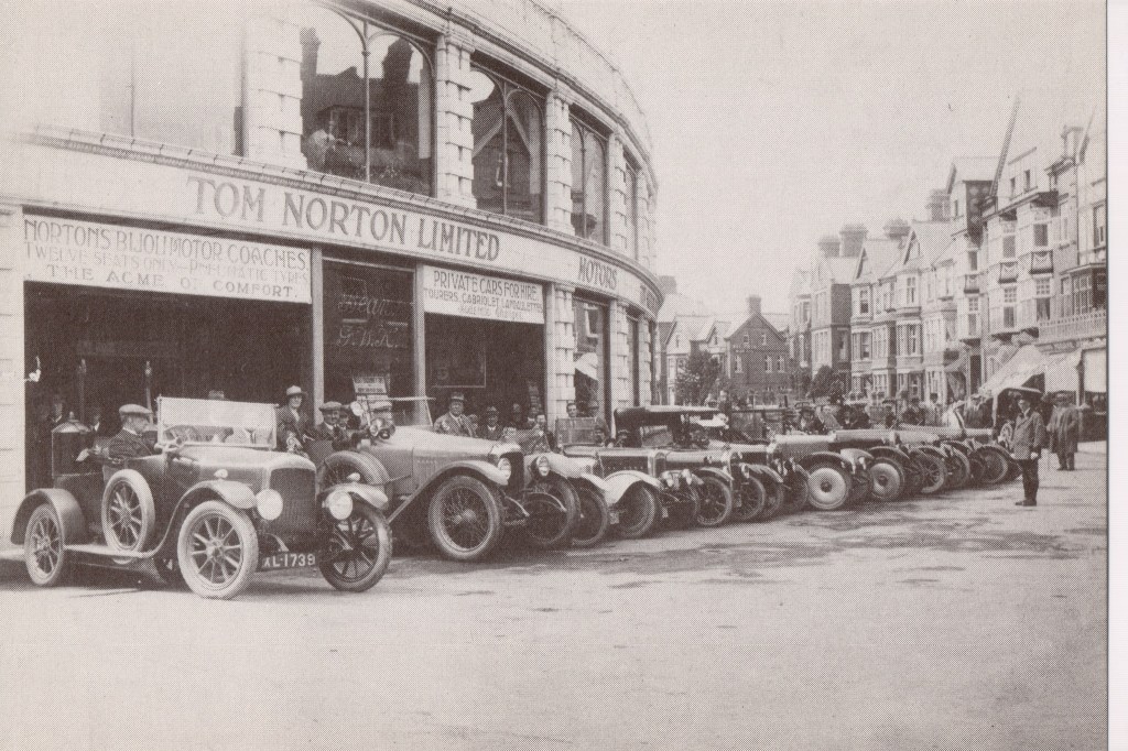 Historic photograph of Tom Norton Ltd motor cars outside the Automobile Palace in Llandrindod Wells